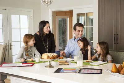 FAMILY AROUND KITCHEN ISLAND